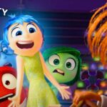 Movie Poster for Inside Out 2 featuring a cartoon of a teenage girl with blue hair and a green dress surrounded by the creatures that represent her moods.