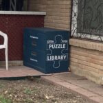 Little Free Puzzle Library box on front porch