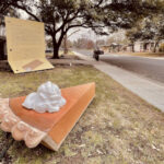 Sculpture of Large slice of Pie and a house size letter to the neighborhood